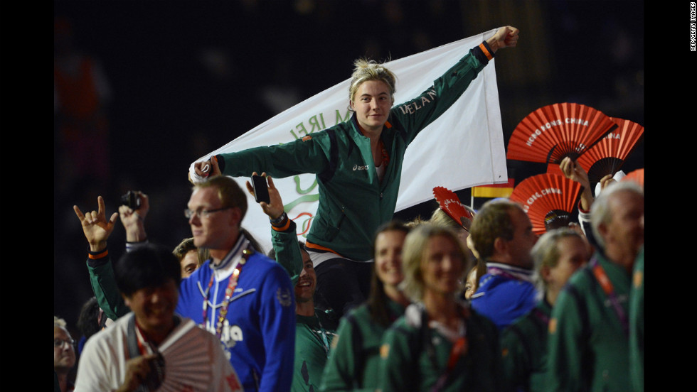 Athletes wave Irish flags at the Olympic stadium.