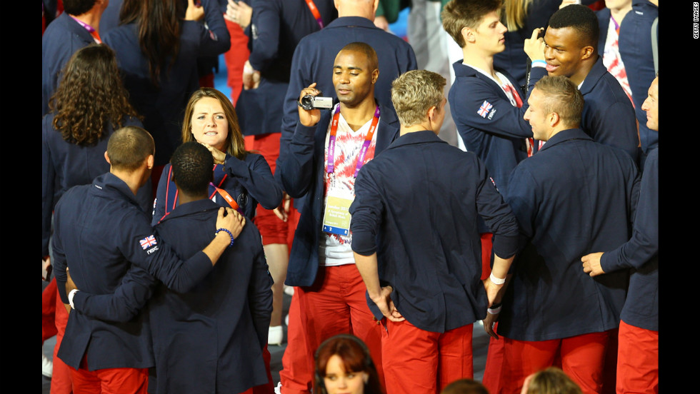 Athlete Mark Lewis-Francis of Great Britain films teammates.