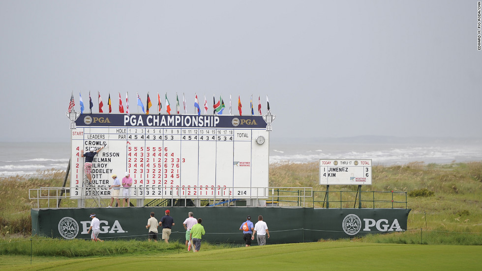 Changes are made to the leaderboard during a delay in play due to weather Saturday.
