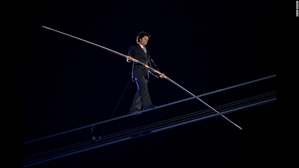 A high-wire artist performs during a rendition of Pink Floyd&#39;s &quot;Wish You Were Here.&quot;