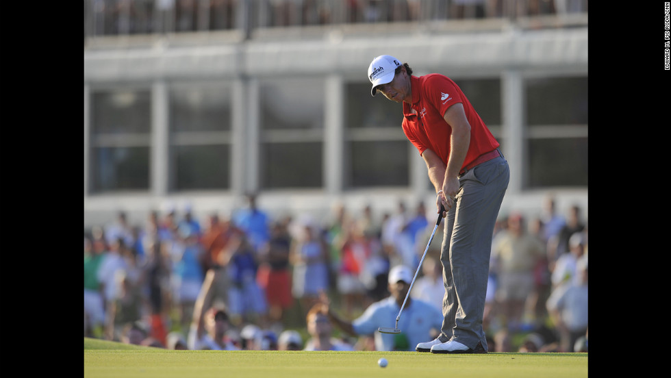 Rory McIlroy sinking the winning putt.