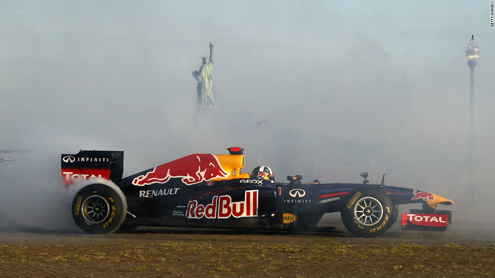 Coulthard burns rubber, while the Statue of Liberty can be seen poking through the thick cloud of smoke.