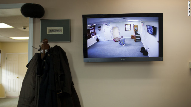 A CCTV monitor displays a man praying February 25 at the Iqra Masjid in Brooklyn, New York. 