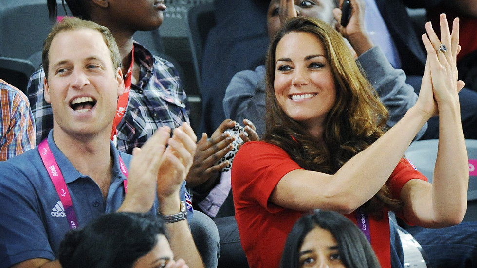 Prince William and his wife, Catherine, applaud as they watch British cyclist Sarah Storey break a world record in her C5 individual pursuit heat.