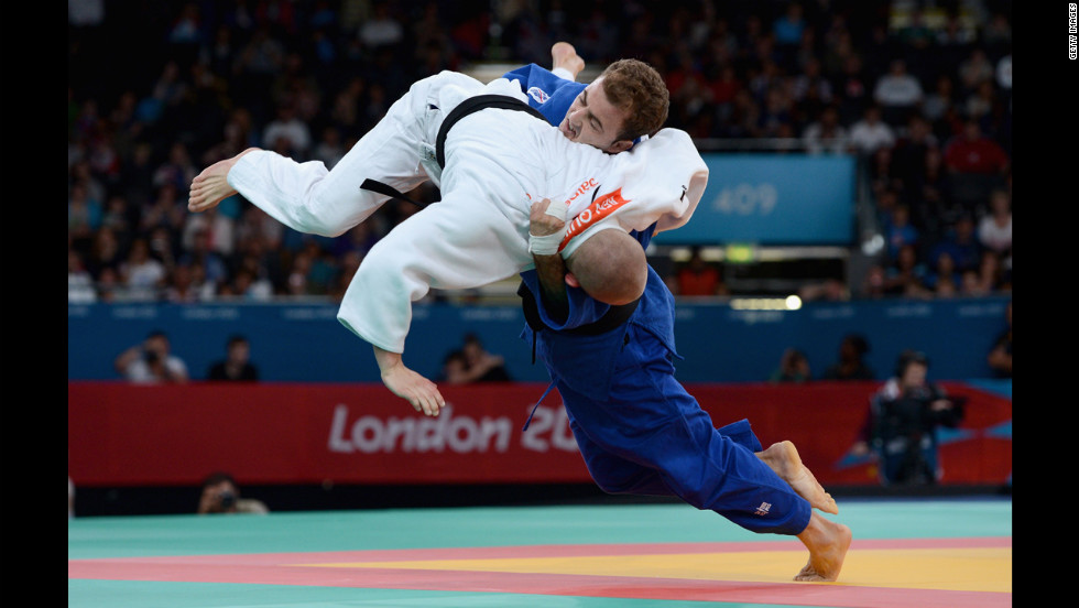 Ben Quilter, in white, of Great Britain competes against Mouloud Noura of Algeria during the men&#39;s -60 kilogram judo quarterfinal match.