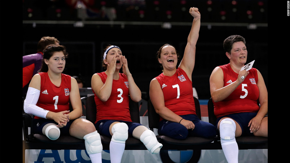 Julie Rogers, from left, Jessica Frezza, Martine Wright and Andrea Green of Great Britain react to a point during the opening game of the womens sitting volleyball tournament against Ukraine.