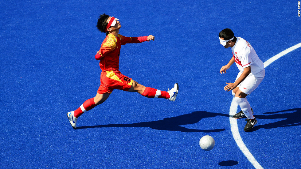 Chinese Zhoubin Wang, left, chases the ball during the men&#39;s team football five-a-side match against Turkey.