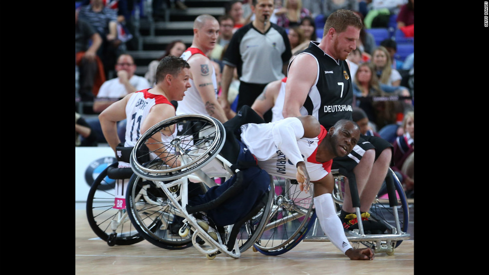 Great Britain&#39;s Ade Oregbemi takes a tumble in the preliminary men&#39;s wheelchair basketball match, which Germany won 77-72, on Thursday, August 30.