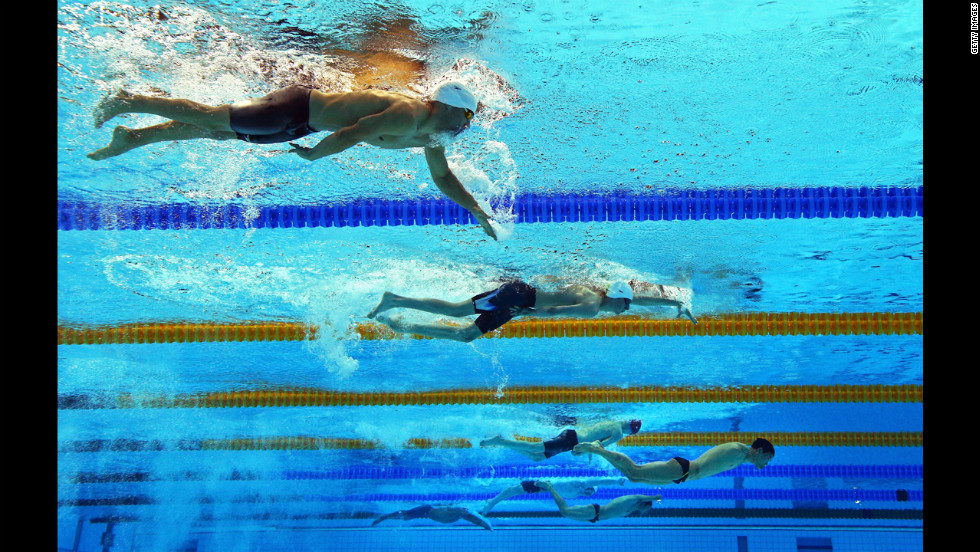 Swimmers compete in the men&#39;s 200-meter individual medley SM6 heat 2 at the Aquatics Center.