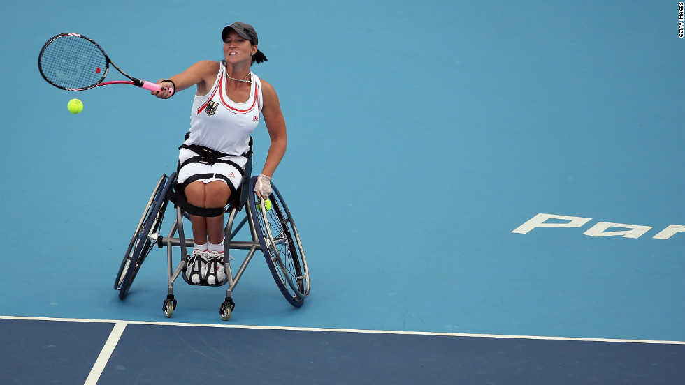 Katharina Kruger of Germany plays a shot while competing with Sabine Ellerbrock against Jordanne Whiley and Lucy Shuker of Great Britain during the women&#39;s doubles wheelchair tennis quarterfinal match on Tuesday.
