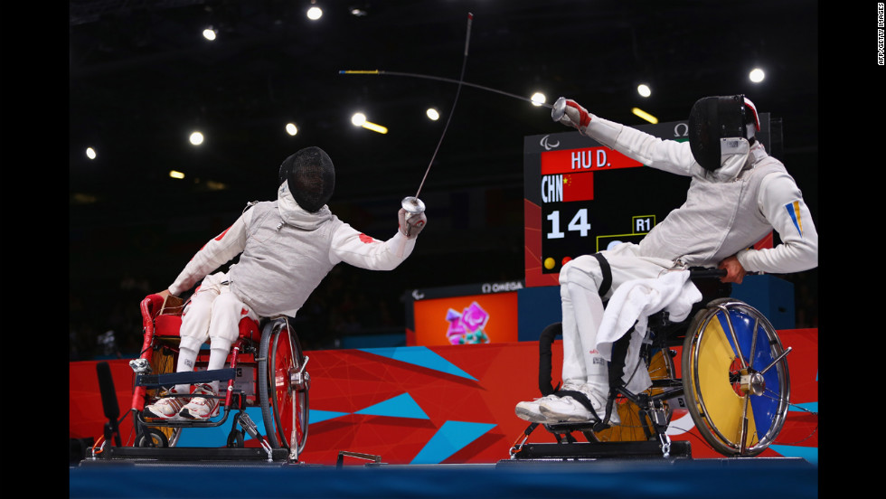 Chinese Daoliang Hu, left, on his way to winning gold against Ukrainian Anton Datsko on Tuesday during the men&#39;s final of wheelchair fencing.