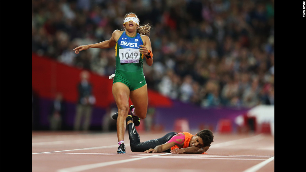 Brazilian Terezinha Guilhermina loses her guide Guilherme Soares de Santana after he fell in the Women&#39;s 400-meter  T12 final at the 2012 London Paralympic Games on Tuesday, September 4.