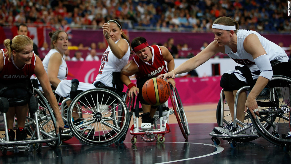 Natalie Schneider of the United States reaches for the ball in the women&#39;s wheelchair basketball quarterfinals against Canada on Tuesday.