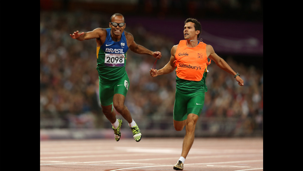 Daniel Silva of Brazil and guide Heitor de Oliveira Sales win silver in the men&#39;s 200-meter  - T11 final on Tuesday.