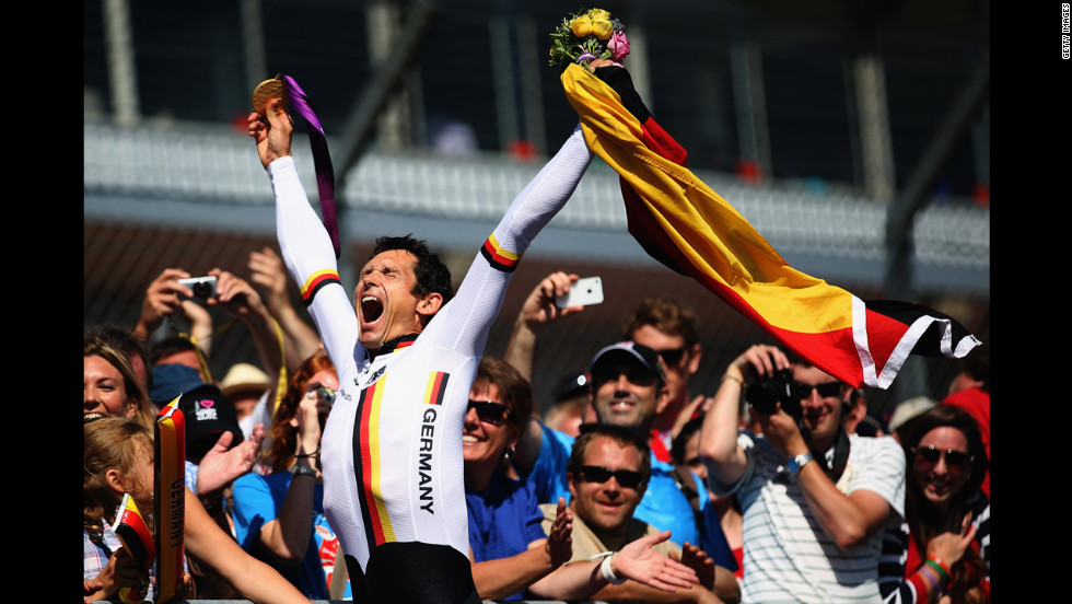 Michael Teuber of Germany celebrates winning the men&#39;s individual C 1 time trial on Wednesday.