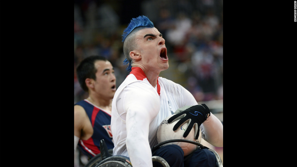 Britain&#39;s David Anthony, center, reacts to scoring a goal against the United States during a Pool A wheelchair rugby match on Wednesday.