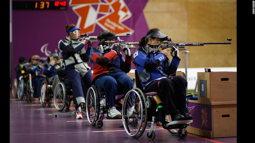Yoojeong Lee of the Republic of Korea, right, shoots during the women&#39;s R8-50m rifle 3 positions-SH1 final on Thursday.