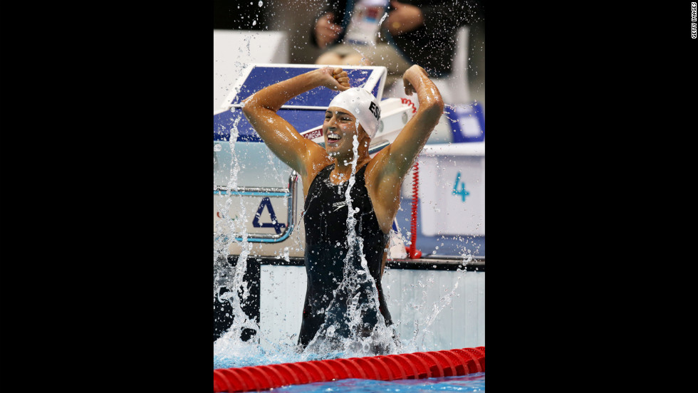 Michelle Alonso Morales of Spain celebrates after winning gold in the women&#39;s 100m breaststroke - SB14 final on Thursday.