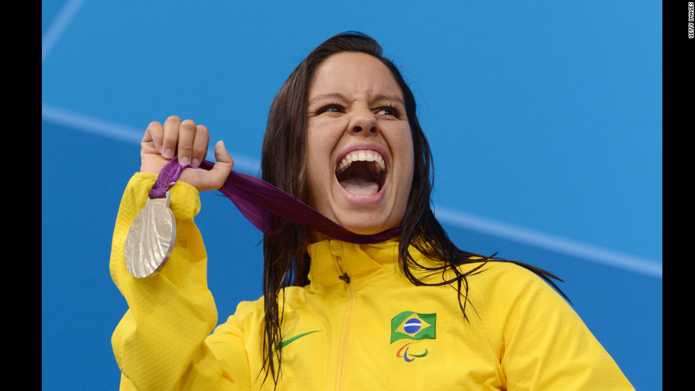 Silver medallist Edenia Garcia of Brazil poses on the podium during the medal ceremony for the women&#39;s 50m backstroke - S4 final on Thursday.