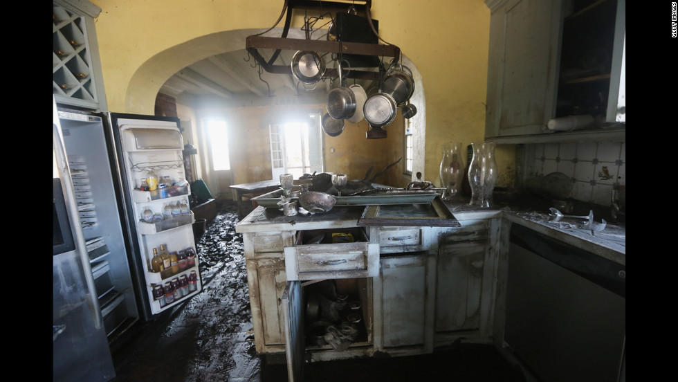 Mud coats the kitchen of the flooded Mary Plantation House, the oldest structure in Louisiana&#39;s Plaquemines Parish, on Thursday, September 6. At least 13,000 homes were damaged throughout Louisiana after Hurricane Isaac came ashore last week, a state official estimates.