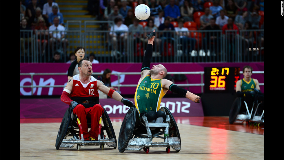 Australia&#39;s Chris Bond reaches for the ball during the mixed wheelchair rugby open match against Belgium on Friday.