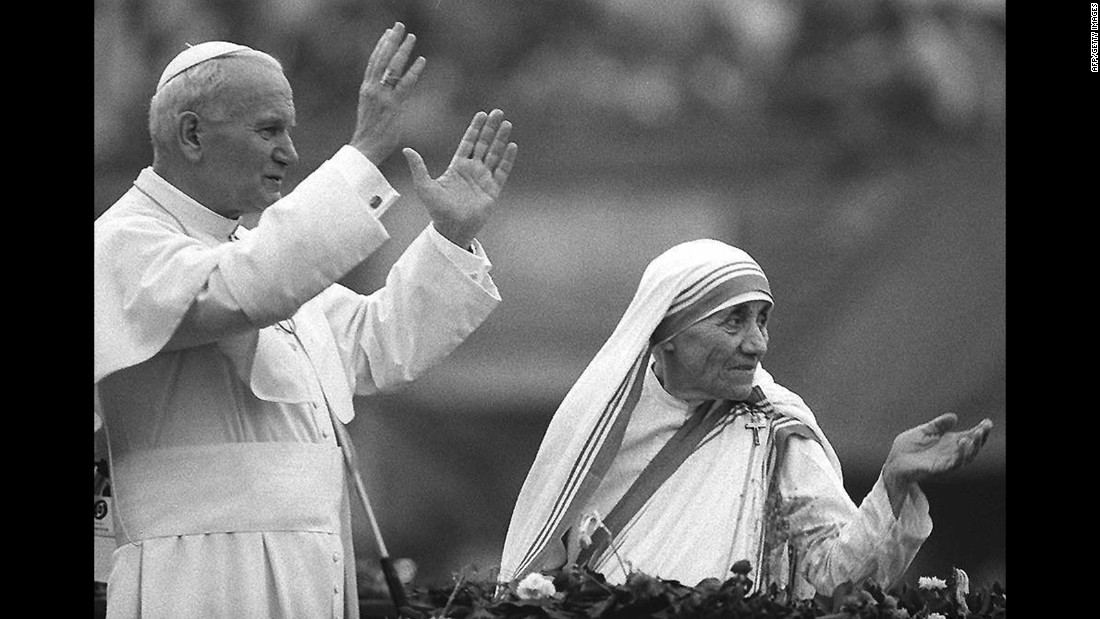Pope John Paul II and Mother Teresa wave to well-wishers in Calcutta on February 3, 1986.