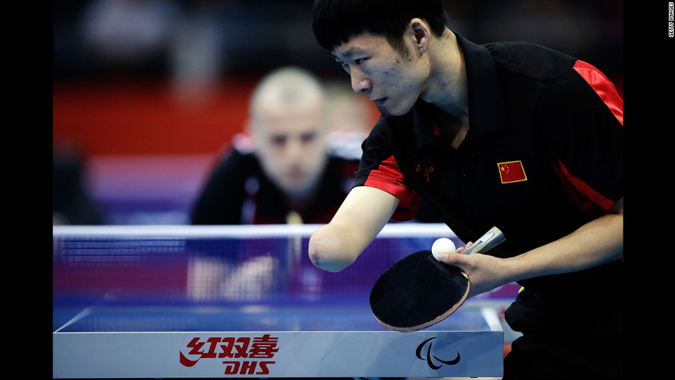 China&#39;s Yang Ge serves against Poland&#39;s Sebastian Powrozniak during the men&#39;s team table tennis Class 9-10 final on Saturday.