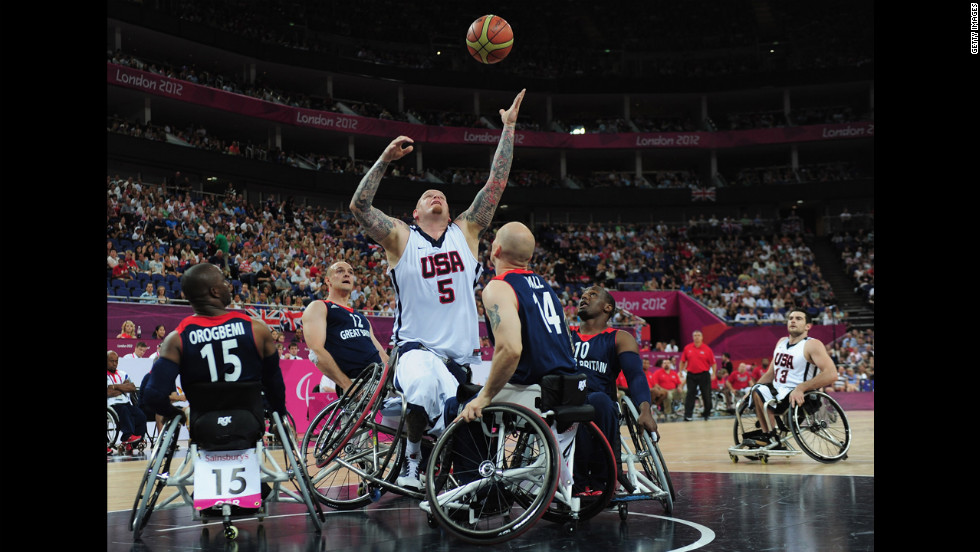 The United States&#39; Joseph Chambers reaches for the ball during Saturday&#39;s bronze medal wheelchair basketball game between United States and Great Britain.