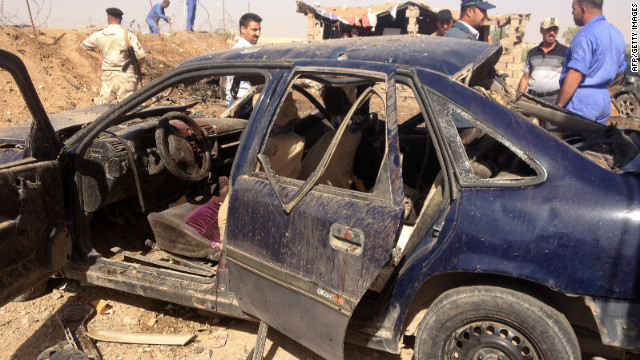 Iraqis on Sunday inspect the site of a blast about 15 kilometers (nine miles) from the northern city of Kirkuk.