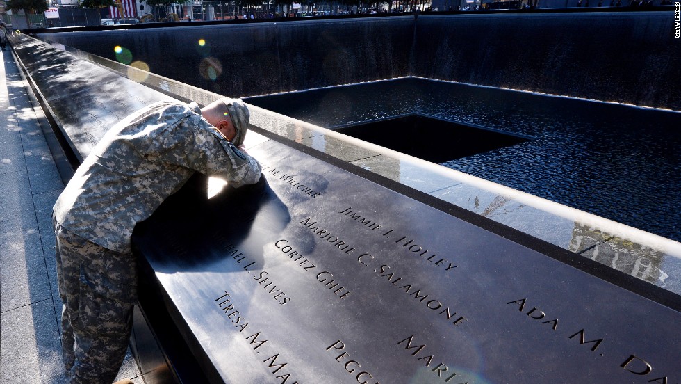 Scott Willens, who joined the U.S. Army three days after the terrorist attacks of 9/11, pauses at the South Pool of the 9/11 Memorial on Tuesday.