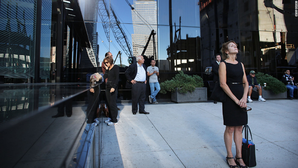  New Yorkers pause near the World Trade Center site on Tuesday.