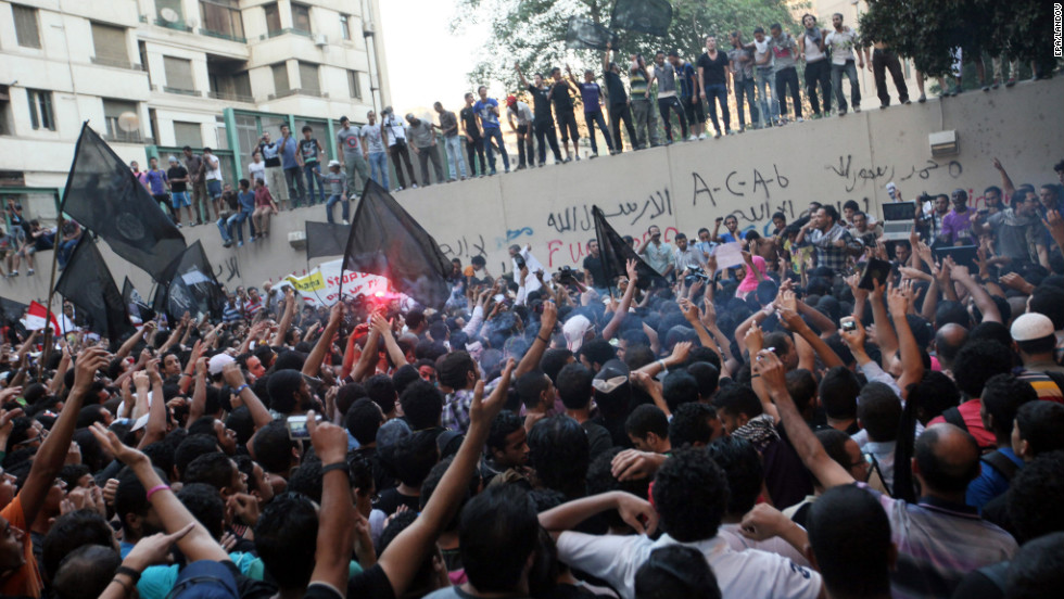 Protesters gather along the U.S. Embassy wall. &lt;a href=&quot;http://www.cnn.com/2012/09/12/africa/gallery/libya-us-consulate-attack/index.html&quot;&gt;Photos: Attack on the U.S. Consulate in Libya kills four&lt;/a&gt; or &lt;a href=&quot;http://www.cnn.com/SPECIALS/world/photography/index.html&quot;&gt;see more of CNN&#39;s best photography&lt;/a&gt;.