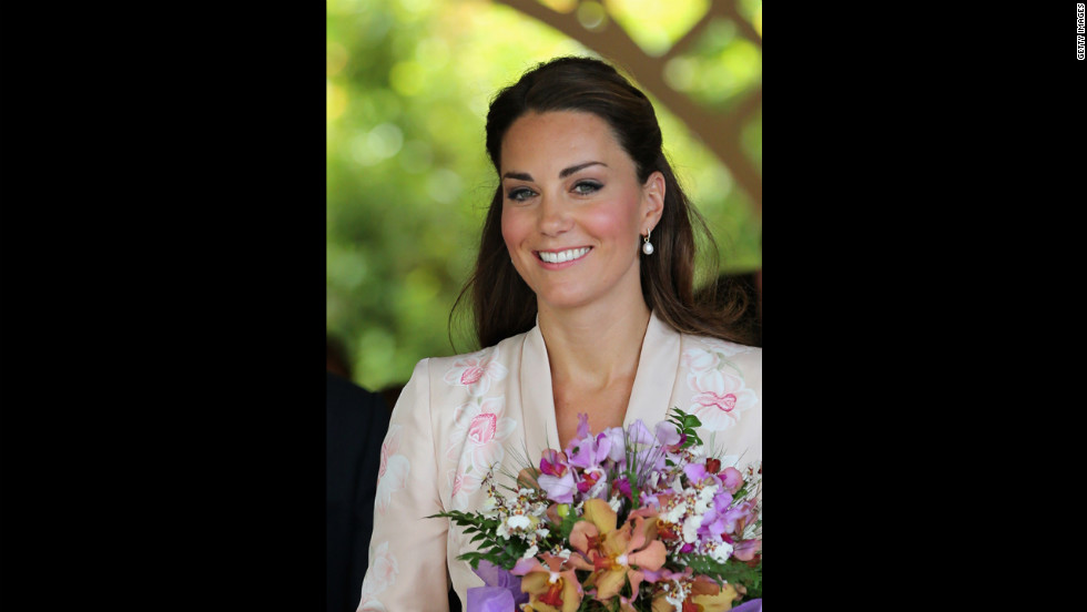 Catherine leaves Singapore Botanic Gardens after visiting on Tuesday.