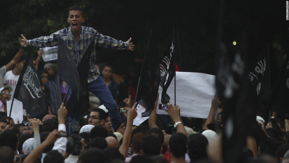 People shout in front of the U.S. Embassy in Cairo.