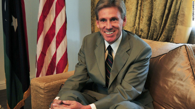 Ambassador Christopher Stevens, smiles in this file photo taken at his Tripoli, Libya, home in June.
