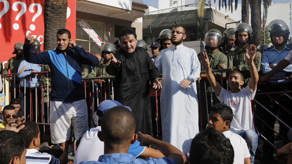 Police confront protesters praying in front of the U.S. Embassy in Casablanca, Morocco, during a rally against the anti-Islam film on Wednesday.