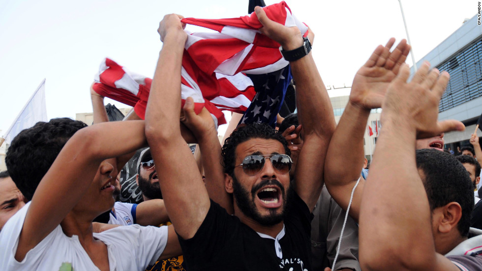 Protesters shout outside the U.S. Embassy in Tunis, Tunisia, on Wednesday, September 12. 