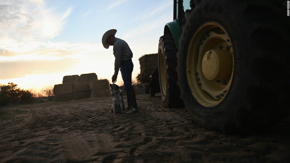 Rancher Gary Wollert pauses before heading out for work on August 23 near Eads, Colorado. The nation&#39;s severe drought has been especially hard on cattlemen. Much of eastern Colorado and virtually all of Nebraska and Kansas are still in extreme or exceptional drought, according to the University of Nebraska&#39;s Drought Monitor.