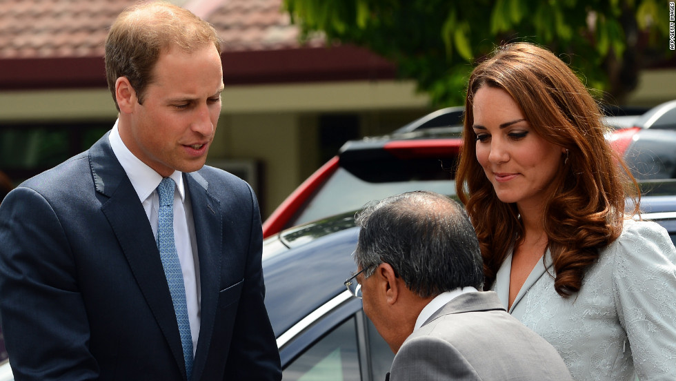 Britain&#39;s Prince William and his wife, Catherine, meet Richard Robless, council member of Hospis Malaysia, in Kuala Lumpur on Thursday.