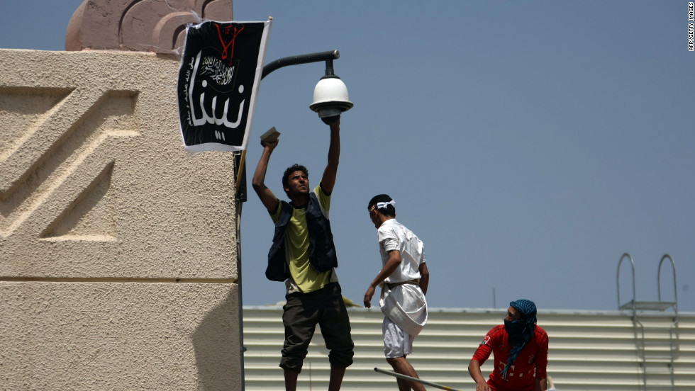 Yemeni protesters try to break the security camera at the U.S. Embassy in Sanaa on Thursday.