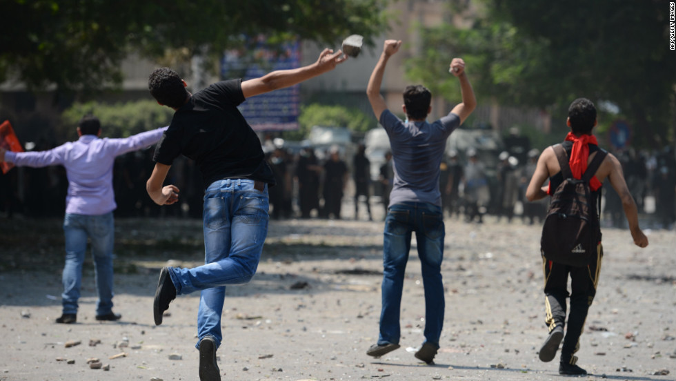 Egyptian protesters clash with riot police Thursday near the U.S. Embassy in Cairo.