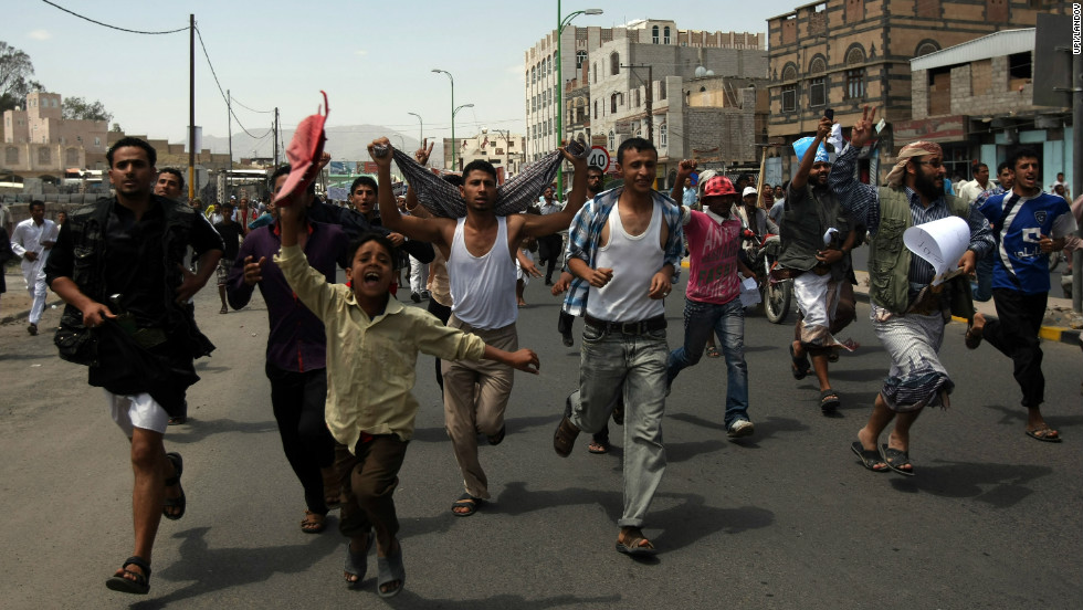 Protesters chant during a march to the U.S. Embassy in Sanaa, Yemen, on Thursday, September 13. One protester was killed in clashes when Yemeni security forces dispersed hundreds of demonstrators who gathered around and inside the U.S. Embassy in Sanaa.