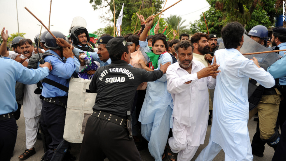 Pakistani soldiers hold back protesters attempting to reach the U.S. Embassy in Islamabad on Friday.