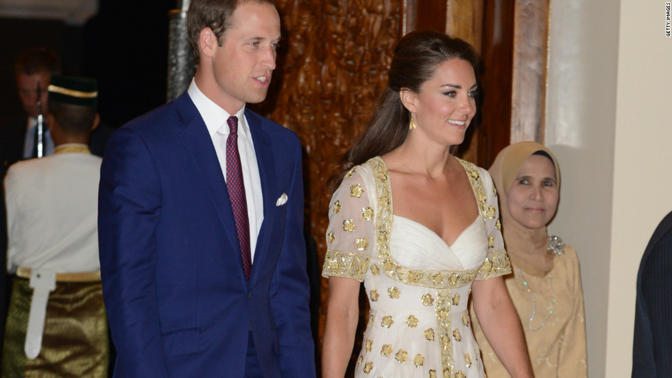 The Duke and Duchess of Cambridge attend an official dinner hosted by Malaysia&#39;s Head of State Sultan Abdul Halim Mu&#39;adzam Shah of Kedah at the Istana Negara on Thursday in Kuala Lumpur, Malaysia. The duchess&#39; evening gown, by Alexander McQueen, features the Malaysian flower, hibiscus, in gold detail.