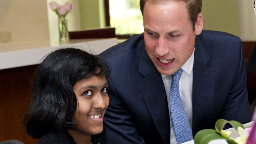 Britain&#39;s Prince William speaks with Linges Warry Apparad, a 14-year-old with leukemia, at Hospis Malaysia Thursday in Kuala Lumpur, Malaysia.