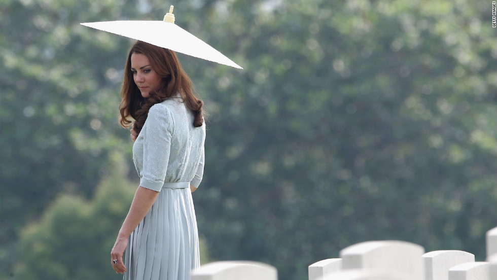 Catherine, Duchess of Cambridge, glances back at war graves as she leaves Kranji Commonwealth War Cemetery on the third day of her Diamond Jubilee Tour of the Far East with husband Prince William on Thursday, September 13 in Singapore.