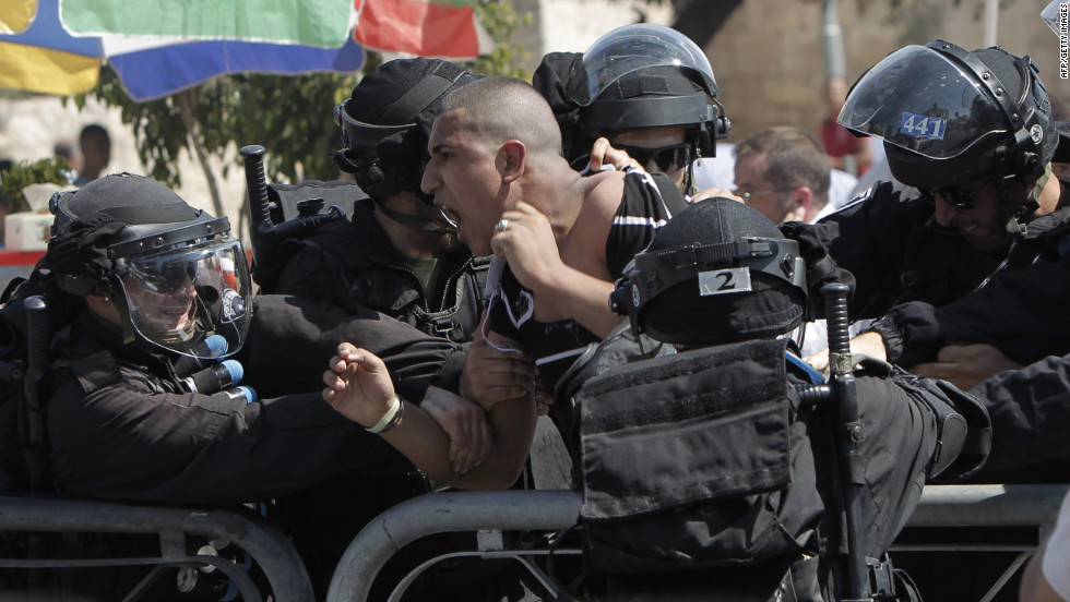 Israeli police arrest a Palestinian protester on Friday.