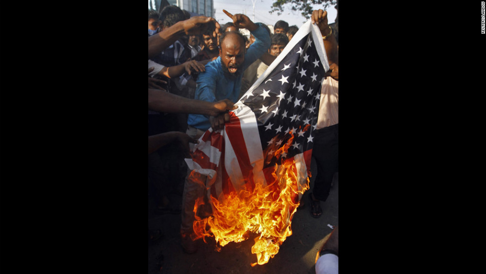 Muslim protesters burn a U.S. flag  outside the U.S. Consulate in the southern Indian city of Chennai on Friday.