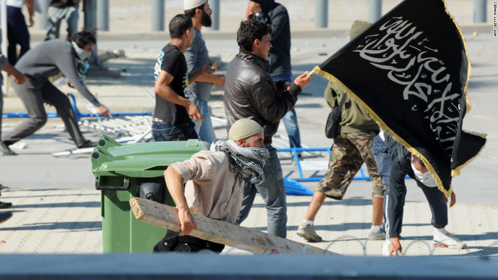 Tunisian protesters try to storm the U.S. Embassy in Tunis on Friday.