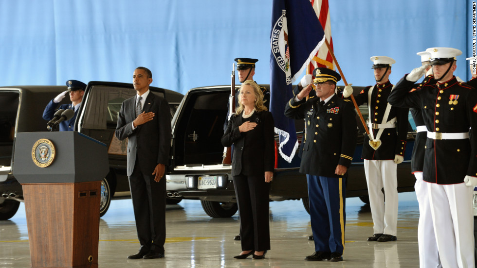 Obama and Clinton stand at Andrews Air Force Base as the bodies of the four Americans killed are returned on September 14.